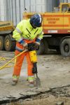 man using pneumatic paving breaker